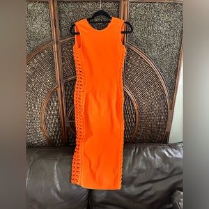 Beautiful bright orange bandage dress with open side detail and small back slit